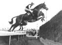 Finnure ridden by Dick Francis jumping the Chair fence in the Champion Chase, 1950.